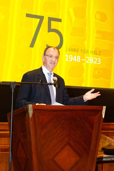 Erich Wiesner speaks on stage at the Park Hyatt.