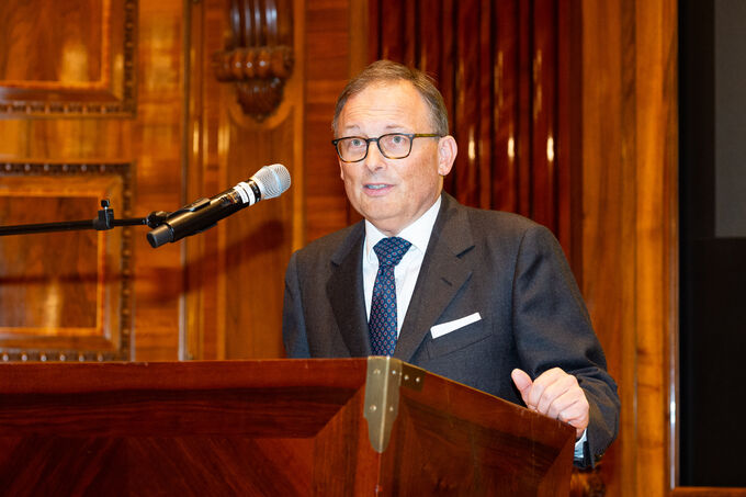 Reinhard V. Mosser speaks at the podium.
