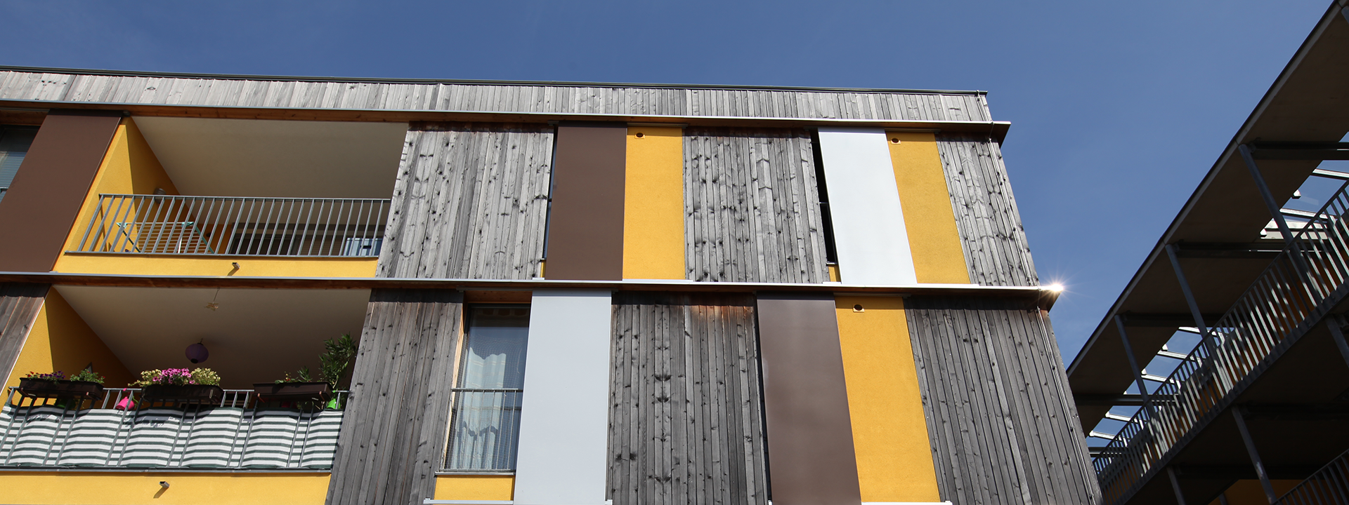 Wooden façade of a multi-storey residential building.